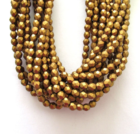 Fifty 4mm Czech glass beads - matte metallic antique gold fire polished faceted round beads C0086