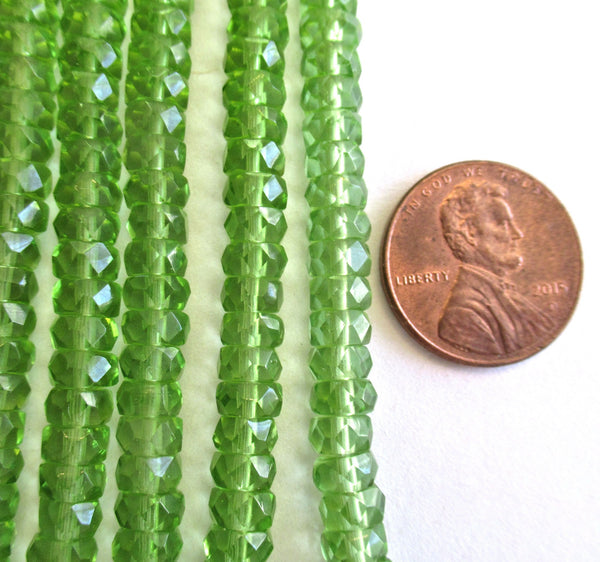 Fifty 6 x 3mm Czech glass faceted rondelle beads - transparent olivine green spacers or rondelles C0037