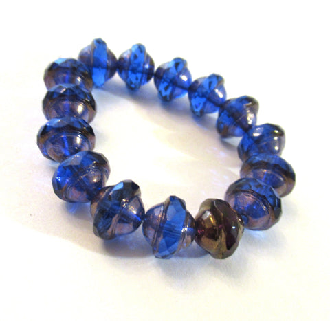 Fifteen Czech glass saturn beads - 8mm x 10mm transparent sapphire blue faceted fire polished saucer beads with a bronze finish - C00971