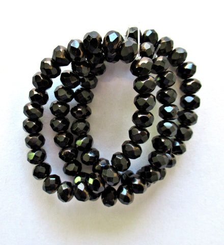 25 Czech glass puffy rondelle or donut beads - 5 x 7mm jet black beads w/ bronze finish on the ends - fire polished faceted rondelles 00612