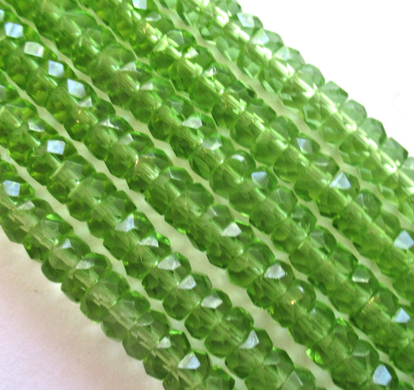 Fifty 6 x 3mm Czech glass faceted rondelle beads - transparent olivine green spacers or rondelles C0037