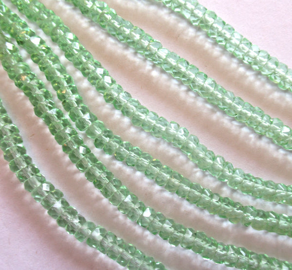 Fifty 6 x 3mm Czech glass faceted rondelle beads - transparent mint or peridot green spacers or rondelles C0037